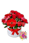 Caja circular de tonos rojos - Flores de Colombia
